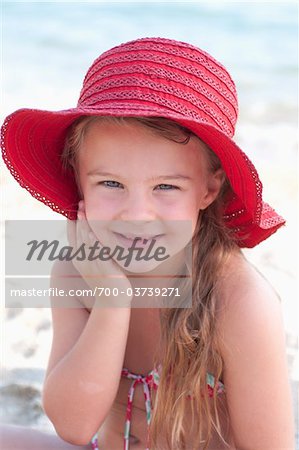 Portrait of Girl Wearing Sunhat at Beach