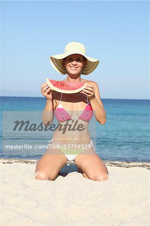 Woman with Watermelon on Beach