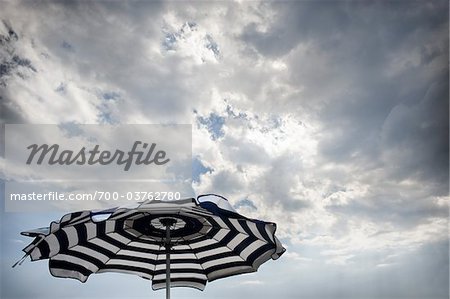 Beach Umbrella and Cloudy Sky