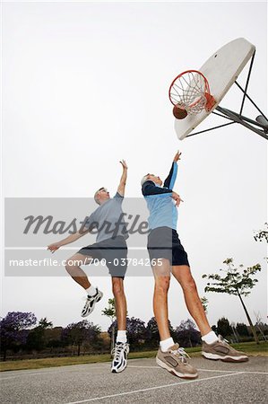 Two Men Playing Basketball