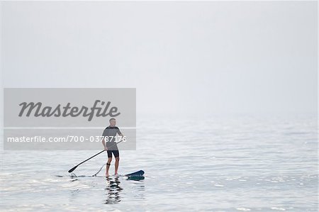Man Paddleboarding