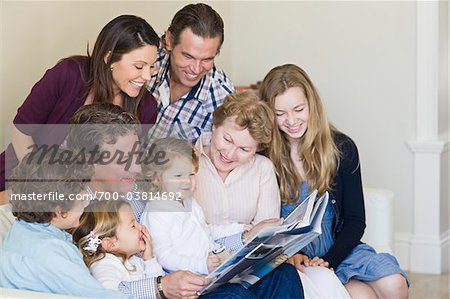 Family Looking at Photo Album