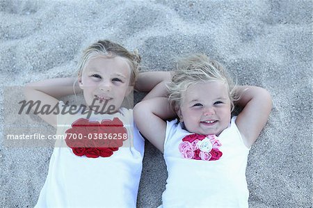 Sister Lying on Beach