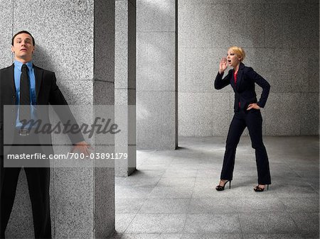 Businessman Hiding from Businesswoman Businessman Hiding from Businesswoman