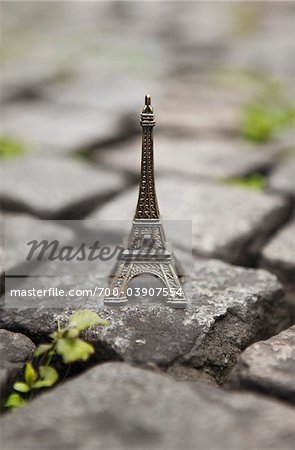 Miniature Eiffel Tower on Cobblestone Street