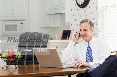 Businessman with Laptop at Home