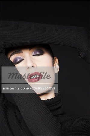 Woman Wearing Turtleneck Sweater in Studio