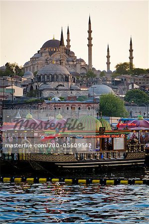 Boats in front of Suleymaniye and Yeni Camii Mosques, Eminonu District, Istanbul, Turkey