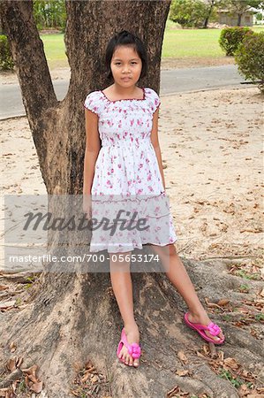 Girl Leaning Against Tree, Bangkok, Thailand