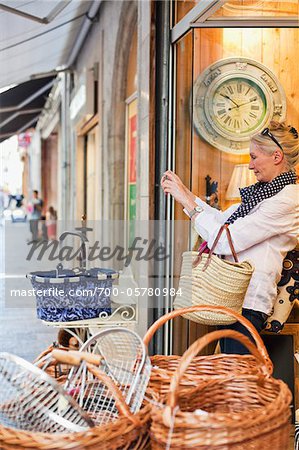 Woman Taking Photograph from Shop