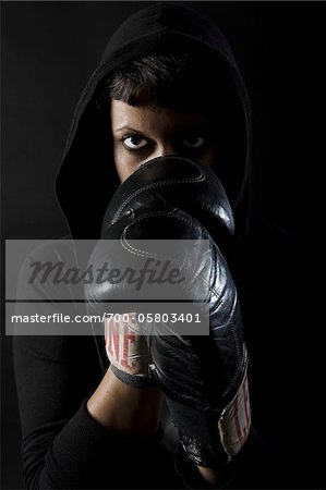 Woman Wearing Boxing Gloves and Hoodie Woman Wearing Boxing Gloves and Hoodie