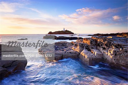 Rocky Coastline and Lighthouse, Godrevy Point, Cornwall, England Rocky Coastline and Lighthouse, Godrevy Point, Cornwall, England