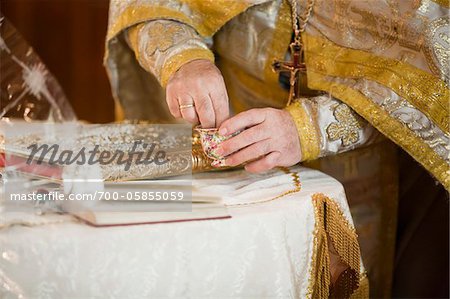 Close-Up of Priest Performing Wedding Ceremony