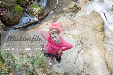 Teenage Girl Standing on Rock