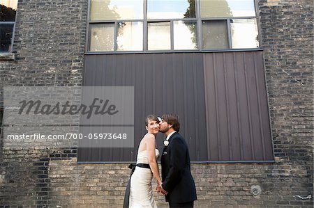 Groom Kissing Bride on Cheek