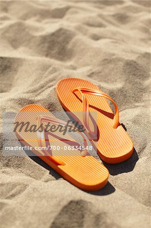 Orange Flip Flops on Beach