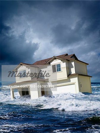 House Floating in Middle of Ocean - Stock Photo - Masterfile