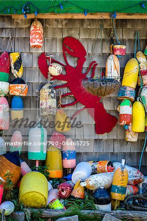 Buoys and Red Lobster Cut-Out Hanging on Outer Wall of Building, Southwest Harbor, Mount Desert Island, Maine, USA