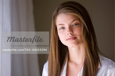 Portrait of Brunette Woman near Window