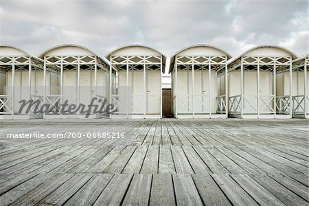 WOODEN BEACH HUTS ON THE BEACH ON A WINTER DAY, OSTIA LIDO, ROME, ITALY