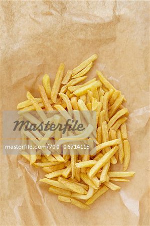 still life of french fries on brown paper