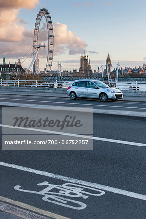 Car parked on Waterloo Bridge with view of the London Eye and The Houses Of Parliment in the background. Wesminster, London, UK