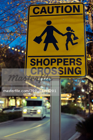 Sign near shopping mall reads: Caution Shoppers Crossing, Austin, Texas, USA Sign near shopping mall reads: Caution Shoppers Crossing, Austin, Texas, USA