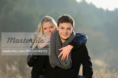 Young couple in an autumn landscape, Bavaria, Germany