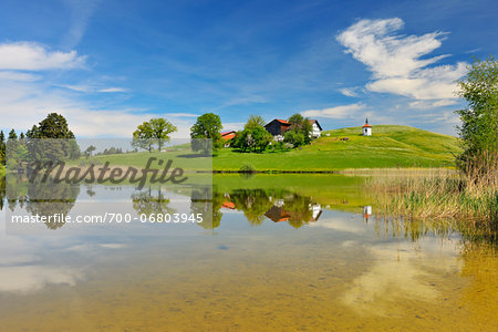 Home on Hill Beside Lake Hegratsrieder See in Spring, Hegratsried, Halblech, Swabia, Bavaria, Germany