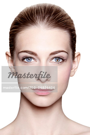 Close-Up Portrait of Young Woman with Slicked Hair on White Background