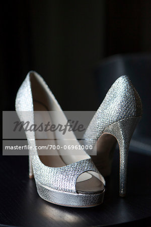 Close-up of silver dress shoes, studio shot on black background