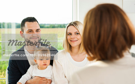 Family Talking to Consultant at Home, Mannheim, Baden-Wurttermberg, Germany