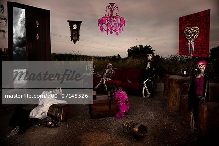 Group of Skeletons Sitting in Living Room without Ceiling and Wall