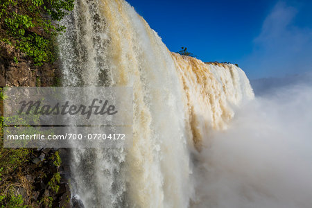Close-up of waterfall cascading over edge, scenic view of Iguacu Falls, Iguacu National Park, Parana, Brazil