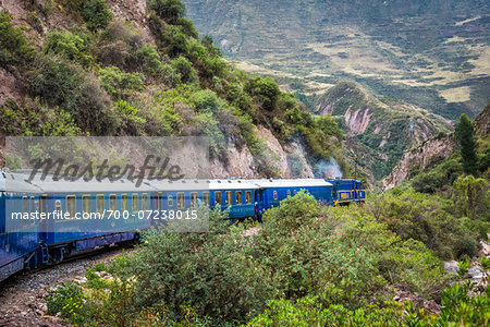 Hiram Bingham train travelling through scenic hills, Peru