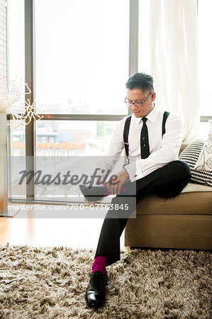 Groom putting on Shoes before Wedding Groom putting on Shoes before Wedding