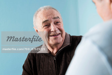 Senior male patient consulting doctor in office, Germany Senior male patient consulting doctor in office, Germany