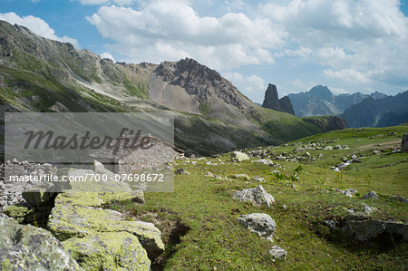 View of Italian Alps in the Maira Valley with typical sheepfold, Italy