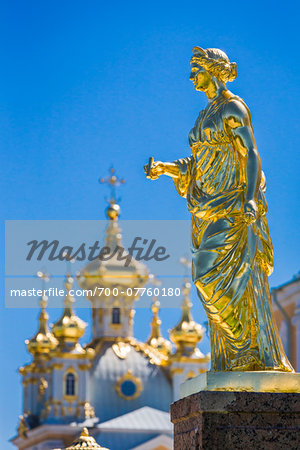 Close-up of golden statue with Church in background, Peterhof Palace, St. Petersburg, Russia