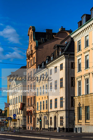 Sunlight reflected on buildings on city street, Gamla stan (Old Town), Stockholm, Sweden