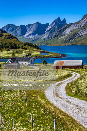 Scenic view of houses, harbour and mountains, Stromsnes, Flakstadoy island, Lofoten Archipelago, Nordland, Northern Norway, Norway