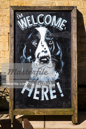 Close-up of sign, welcoming dogs, Bourton-on-the-Water, Gloucestershire, The Cotswolds, England, United Kingdom Close-up of sign, welcoming dogs, Bourton-on-the-Water, Gloucestershire, The Cotswolds, England, United Kingdom