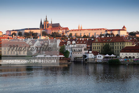 Harbor scene with St Vitus Cathedral in background at sunset, Prague, Czech Republic