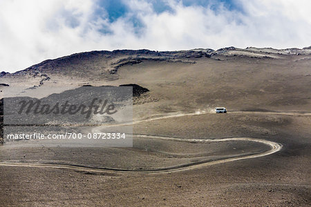 Vehicle on Winding Road, Mount Etna, Sicily, Italy Vehicle on Winding Road, Mount Etna, Sicily, Italy