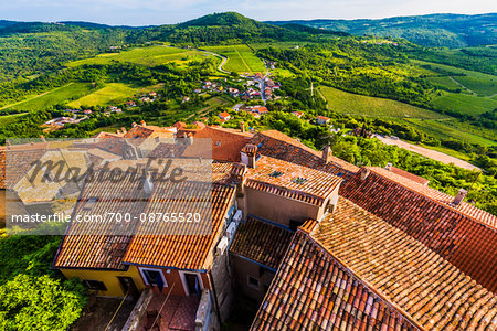 Clay tile rooftops and overview of farmland in the medieval town of Motovun in Istria, Croatia