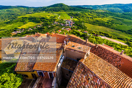 Clay tile rooftops and overview of farmland in the medieval town of Motovun in Istria, Croatia Clay tile rooftops and overview of farmland in the medieval town of Motovun in Istria, Croatia