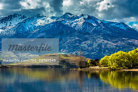Shoreline of lake and mountain range at Glendhu Bay in the Otago Region of New Zealand Shoreline of lake and mountain range at Glendhu Bay in the Otago Region of New Zealand