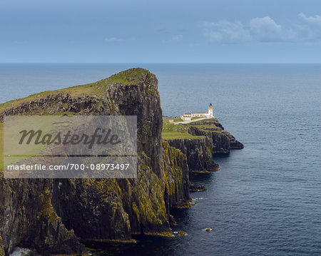 Scottish coast with Neist Point Lighthouse on the Isle of Skye in Scotland, United Kingdom Scottish coast with Neist Point Lighthouse on the Isle of Skye in Scotland, United Kingdom