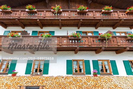 Traditional architecture with wooden balconies, shutterd windows and flowerboxes in the town of Mittenwald in Bavaria, Germany