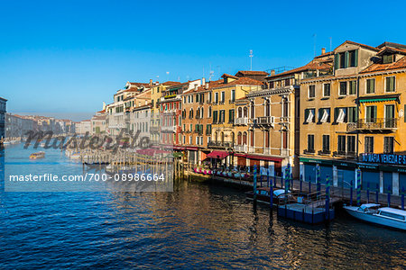 Overview of the historical buildings along the Grand Canal on a sunny morning in Venice, Italy